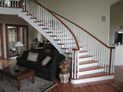 Free Standing Staircase with Sheridan Balustrade and Maple Treads